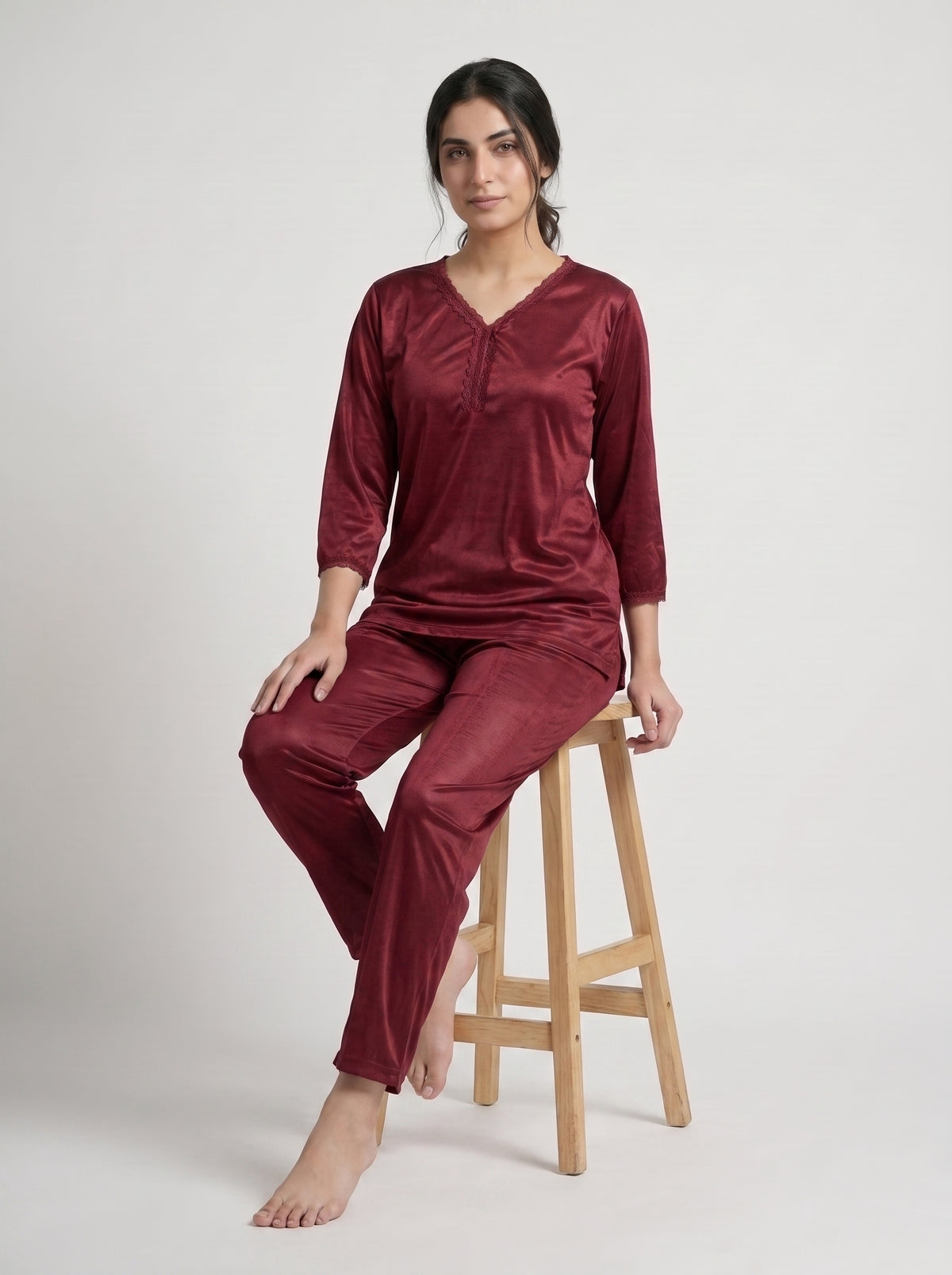 Elevate your nighttime wardrobe with this elegant maroon satin night suit, designed for comfort with a sophisticated touch