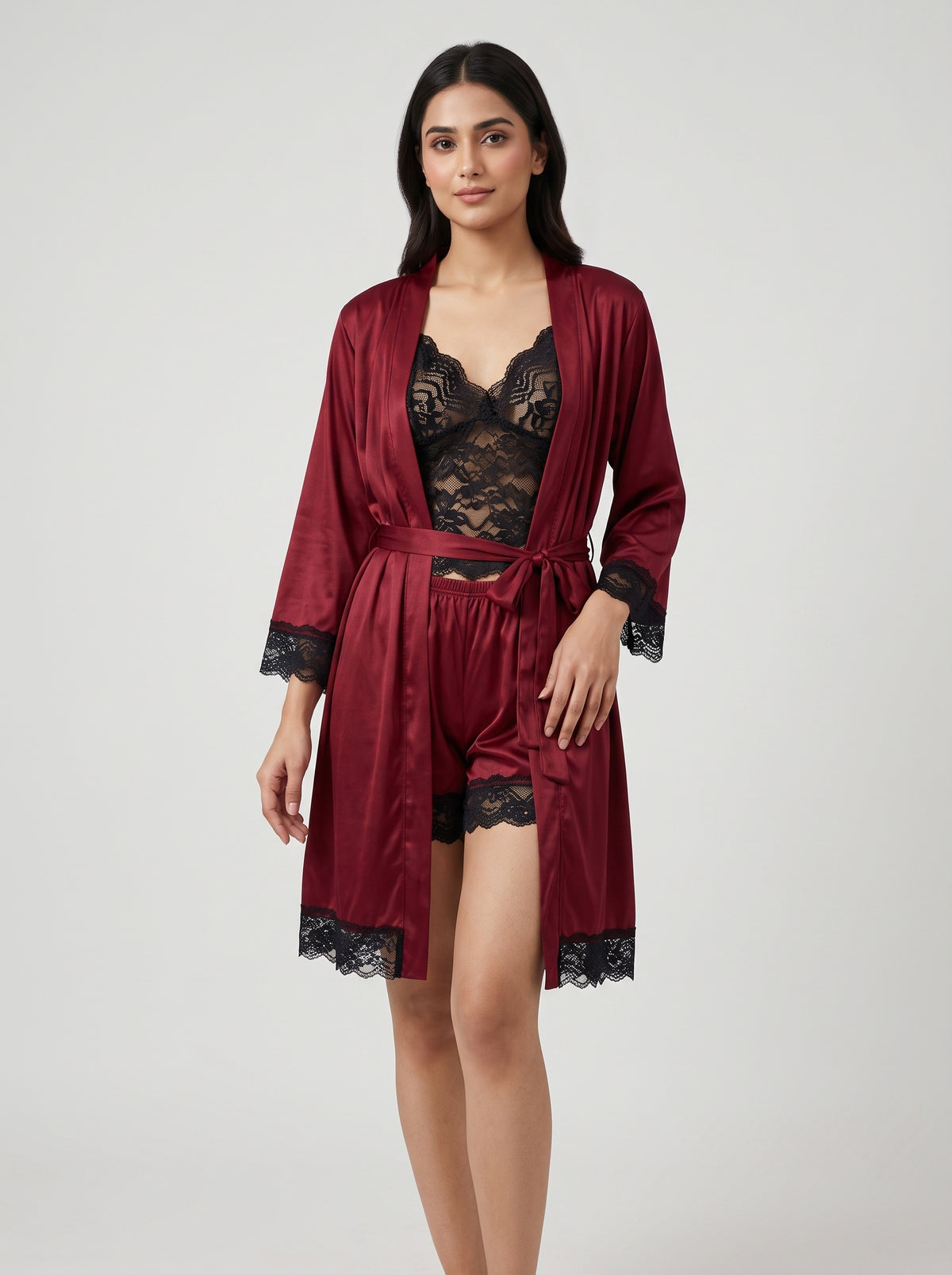 Add a touch of luxury to your nightwear collection with this elegant maroon satin robe set, beautifully finished with contrasting black lace detailing