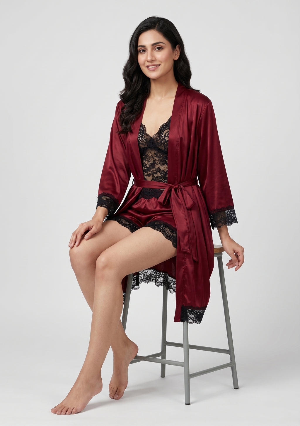 Add a touch of luxury to your nightwear collection with this elegant maroon satin robe set, beautifully finished with contrasting black lace detailing